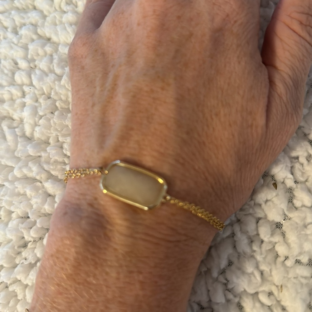 Dainty gold bracelet with pale pink stone